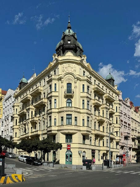 Six storey pale yellow Gründerzeit corner house freshly renovated.